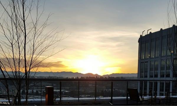 Silhouette of the Cascades at sunrise from the deck of our Rooftop Lounge!