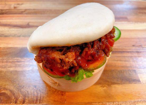 Korean BBQ Beef Bun 
 
 Korean BBQ beef with lettuce, cucumber and spicy Korean sauce