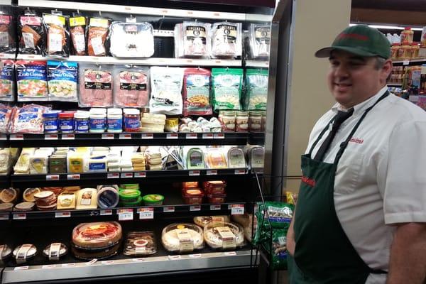 Neal with his specialty meats and cheeses.