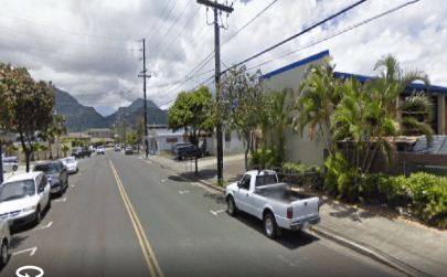 Our entrance is just beyond the Hardware Hawaii Lumber building  and large power pole on the right. We share a wall with Hardware Hawaii.