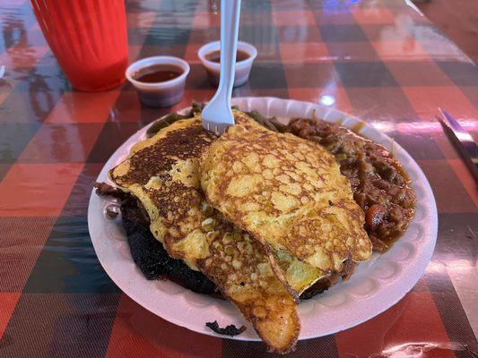 Sliced Texas Style Brisket w/ cornbread pancakes.