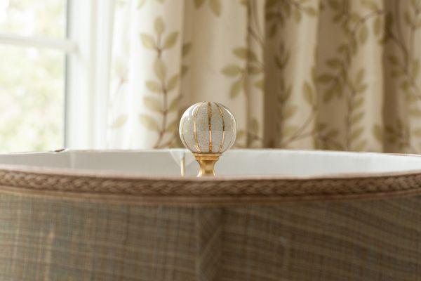 Freshen up your lamp and lampshade with an updated finial.