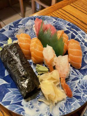 Assorted sushi and a salmon skin hand roll