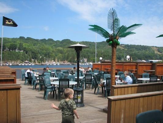 Outdoor dining patio complete with fake palm trees