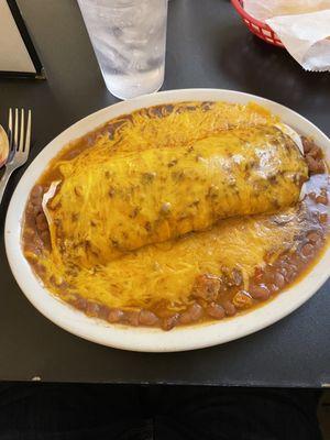 Pork and chili burrito with chili and extra cheese