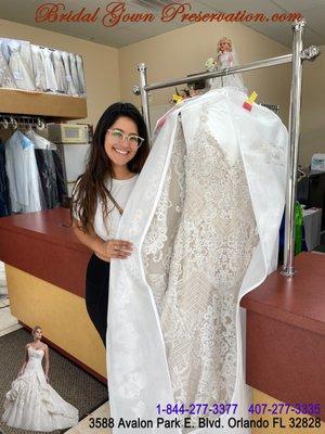 Happy bride picking up her wedding gown.  Thank you dear bride for choosing us to get your gown cleaned by us.