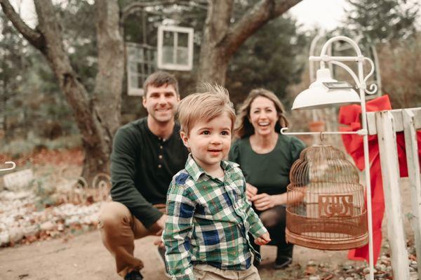 A family session at a greenhouse all decked out for the Christmas, add a toddler literally on the run and some very strong winds.