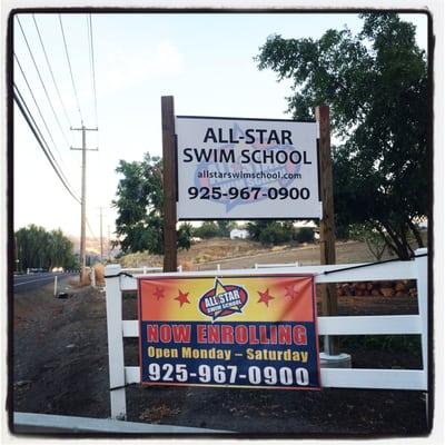 Swim school sign seen along Camino Tassajara