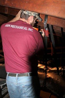 Hard at work installing a duct system in the Texas Heat. What this picture does not show is the temp. 134 degrees in the attic on that day.