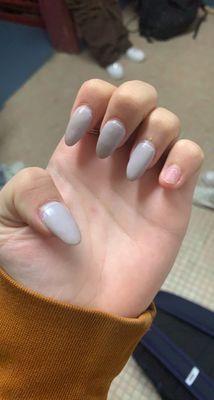 one nail broken, and grey nails