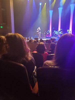 In thr first half of the show Lea Salonga wearing a black suit dress pants attire.