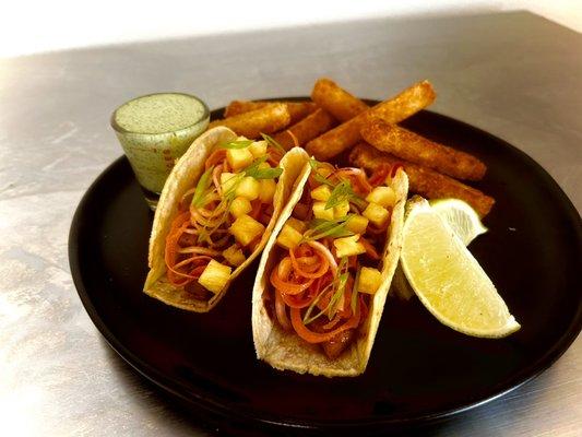 Crispy pork belly tacos with yuca fries