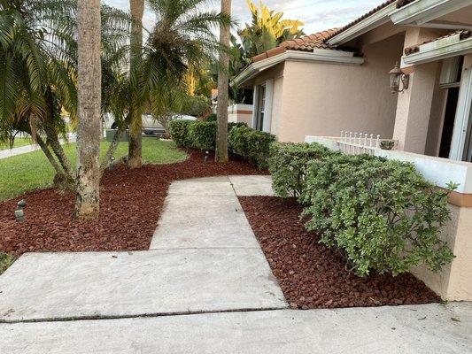 After pictures of the garden installation. We used two pallets of red lava rock and weed blocked the entire bed.