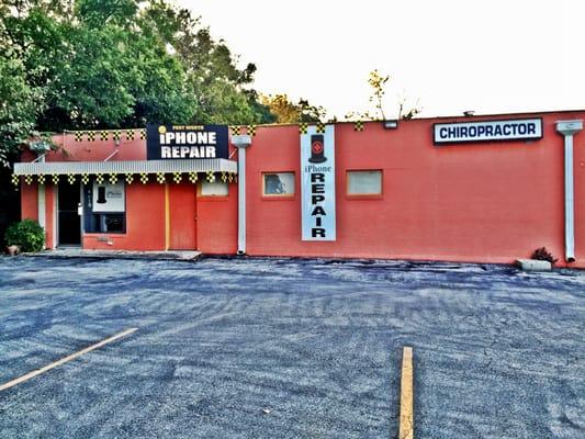 Front of Fort Worth iPhone Repair building. Next to BB salon 63 & the Chiropractor YELLOW CHECKERED FLAGS