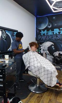 My grandson getting his haircut for school.  Marz is our place.