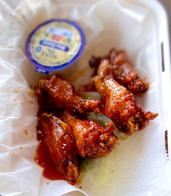 5 pice thai chili bone-in wings with bleu cheese and celery sticks below -takeout - great!