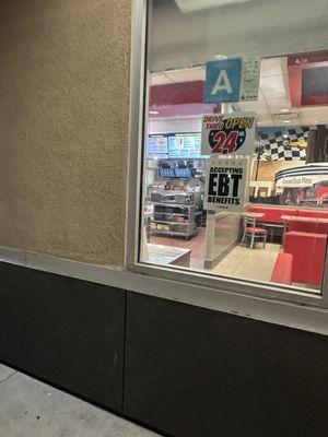 Shift manager sitting where food is prepared