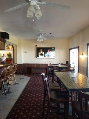 High top tables in bar, just off the porch