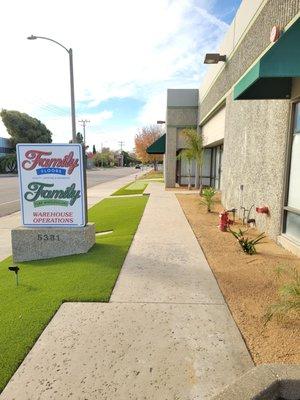 Drought tolerant landscape featuring artificial grass and drought tolerant plants with DG.