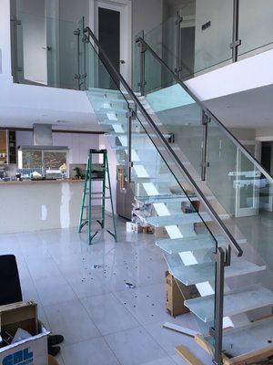 Interior glass railings and guardrails with stainless steel clips