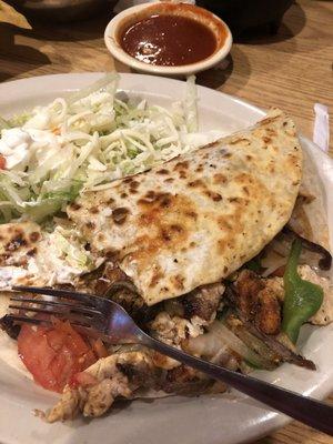 Chicken fajitas quesadillas with red sauce on side