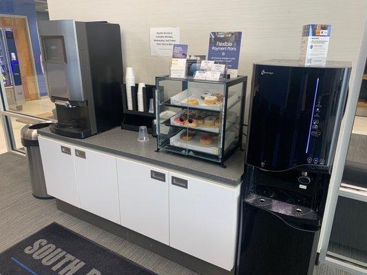 Lounge area, coffee, water and Donuts.