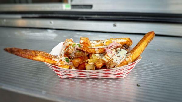 A french fry sampler often featured in their social media feed topped with chimichurri and garlic truffle sauce.