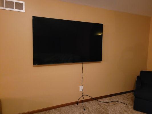 Another 75 inch. 
Going back to move electric and cable behind tv wire free!!!