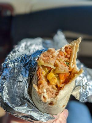 Sweet potato burrito-ito with refried beans, shredded chicken, corn salsa, guacamole, cheese and GHOST HONEY