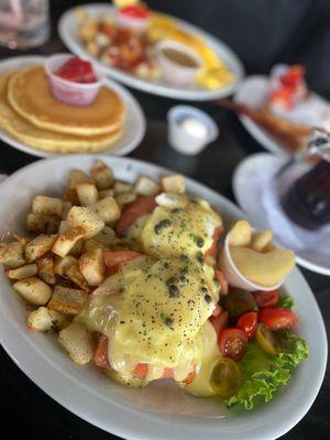 Smoked salmon Benedict  Peasant potatoes  Field tomatoes  and braised granny apple smith Dollar size pancakes