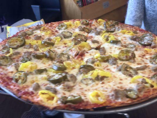 Italian sausage, jalapeños, and banana pepper pizza. Outstanding!