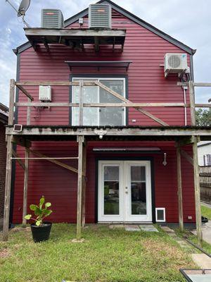 Newly painted rear of home. Ignore the balcony because it needs to be redone.