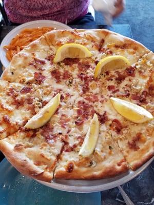 Small white Clam pizza with Bacon and lemon.