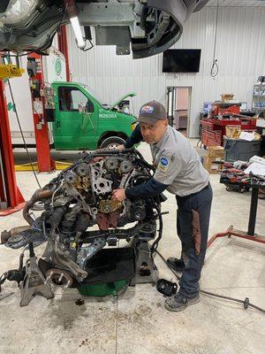 Senior Technician, John, on another engine repair job.