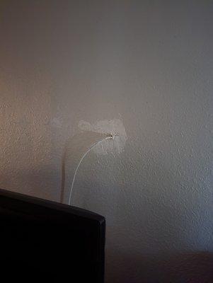 punch a hole in the wall to run cable tv