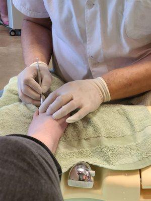 Cuticles being cared for