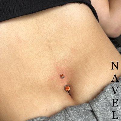 Navel piercing.