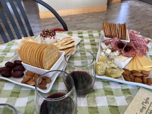 Charcuterie plate on right. Pear and Gorgonzola mini cheese torta on the left.