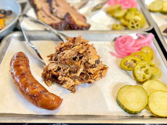 (left) Jalapeño Cheddar Sausage (right) 1/2 lb. Pulled Pork