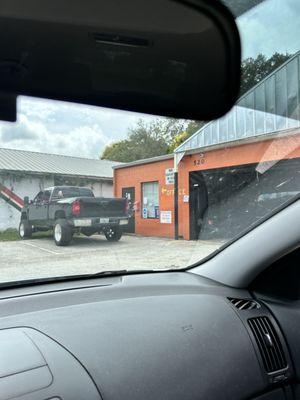 Front of Big Orange Tire & Service Center building.