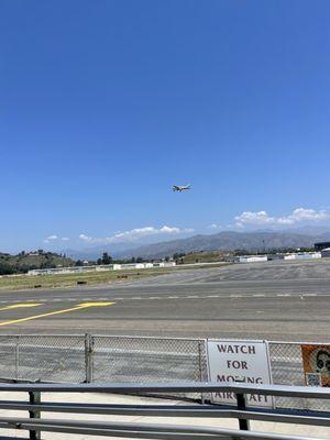 It's a great place to eat, cool breeze and watch airplanes land and take off