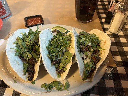 Beef street tacos with flour tortillas.