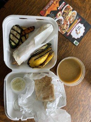 Lunch special: Chicken Shawarma wrap with grilled vegetables on aide and lentil soup and pita bread with special garlic dipping sauce.