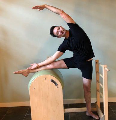 Ballet stretch on the Ladder Barrel