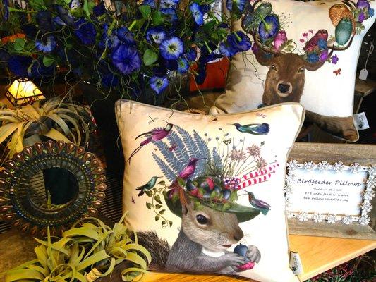 Pillows featuring whimisical art of birds making nests on animals' heads!  Made in England! Fantastic colors!