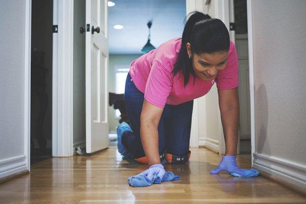 Cruz, hand mopping the floors