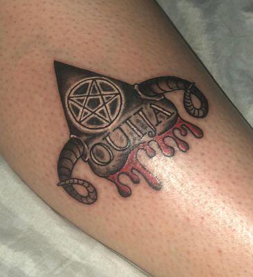 Ouija Planchette Tattoo done by Mike.