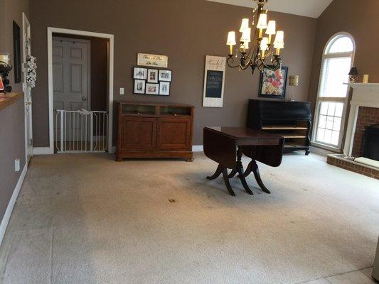 Before (white carpet) and after (luxury vinyl).... perfect for this household with two messy toddlers.