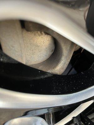 third image close-up of rim heading brake caliper