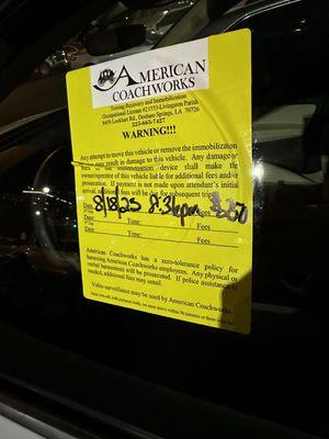 Stuck on drivers window along with 2 boots. Time written on sticker is exactly 2 minutes after we properly parked & paid